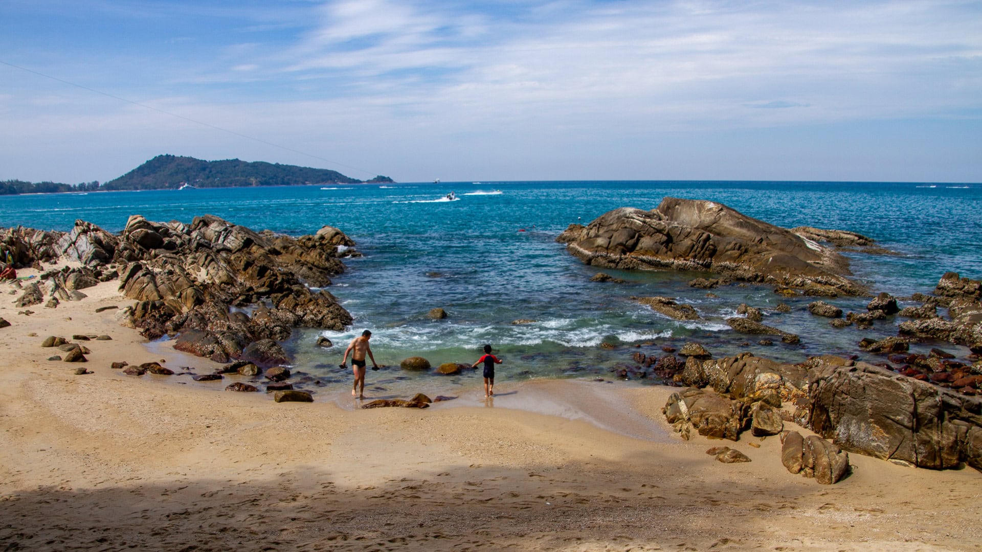Kalim Beach Phuket rocky pools near shore with calm sea