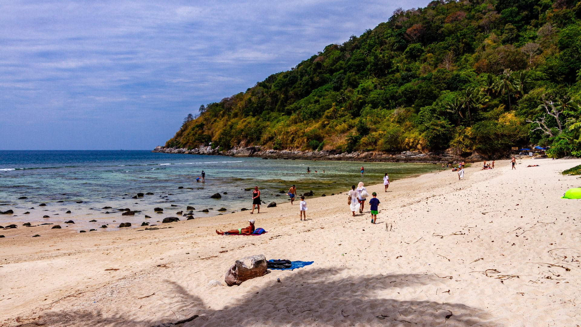 Merlin Beach Phuket showing sandy beach, shallow water, and forested hillside
