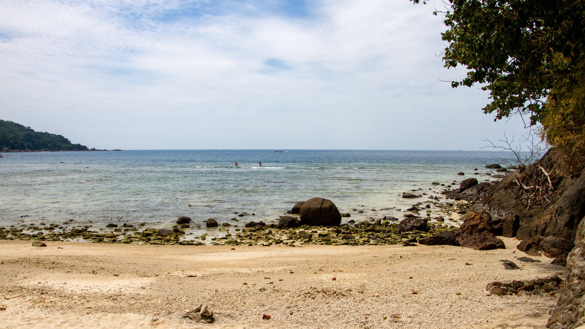 Merlin Beach Phuket wide view of sandy cove and reef flat